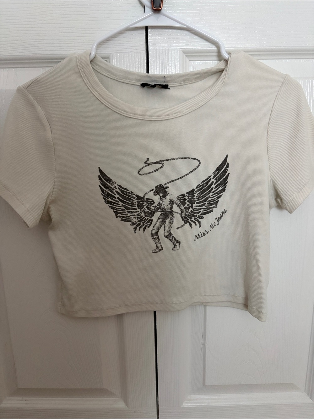 Women Short Sleeve Graphic Tee in Cream with Winged Cowboy Print